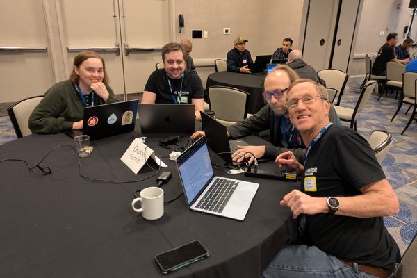 Randy at table doing first-time contributor mentoring.